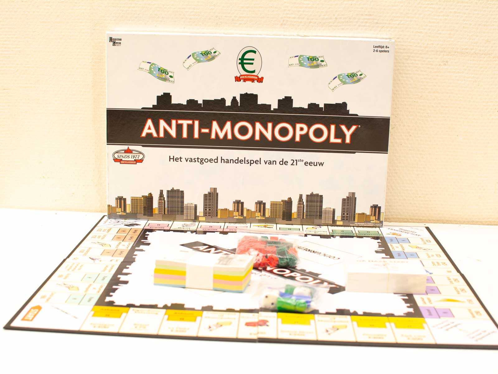 Play ANTI-MONOPOLY, a vibrant real estate board game with strategic trading and urban fun!