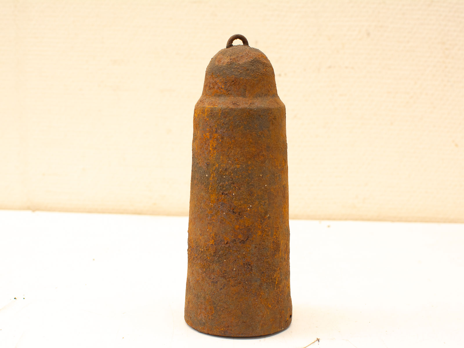 Rustic vintage bell with textured rust finish, ideal for country decor and antique collectors.