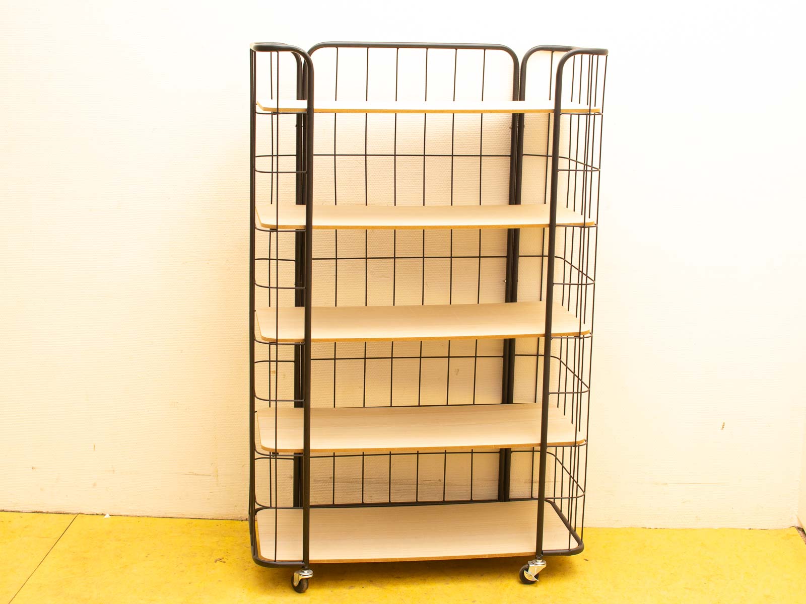 Modern mobile shelving unit with five wooden shelves and a black metal frame for stylish storage.