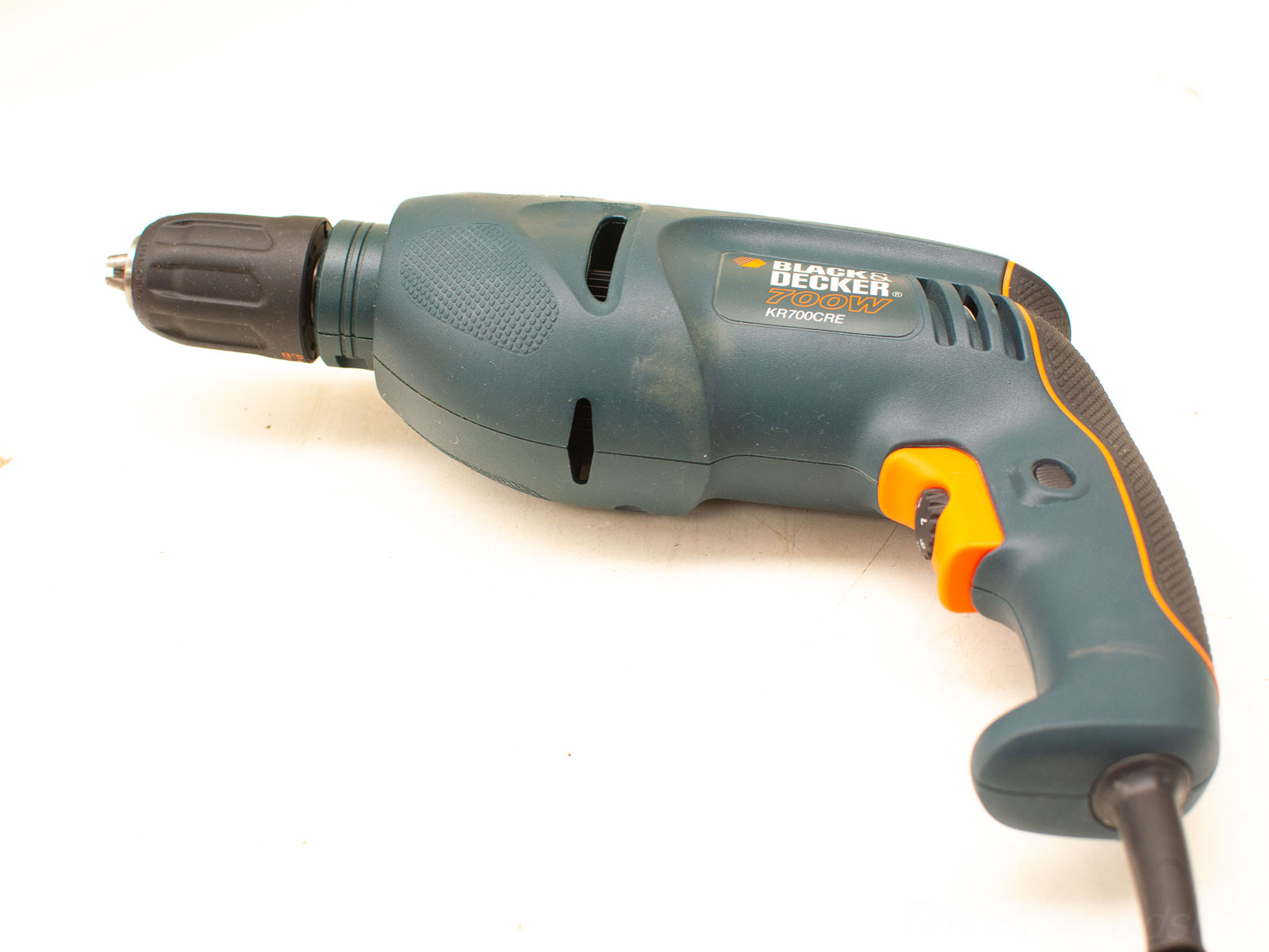 Ergonomic deep teal Black & Decker electric drill with orange trigger for efficient DIY projects.