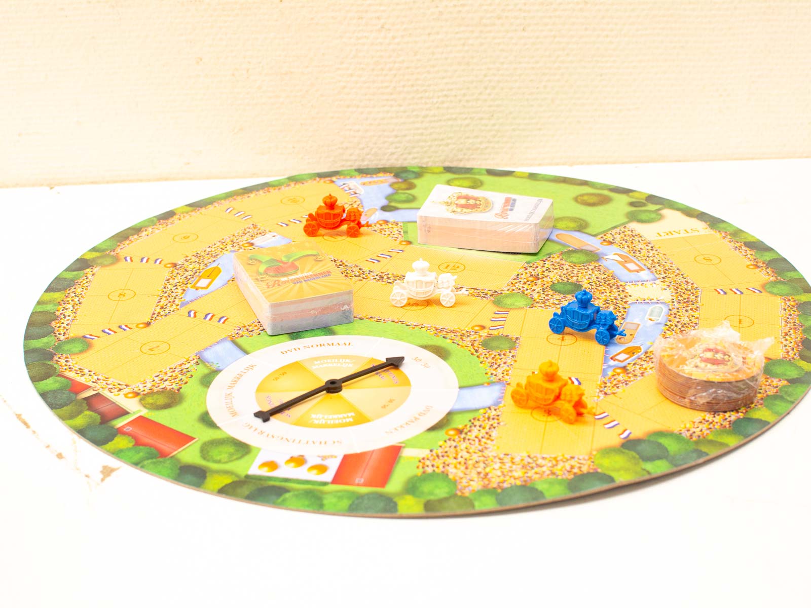 Colorful board game with pathways, spinner, and action cards for family fun and adventure.