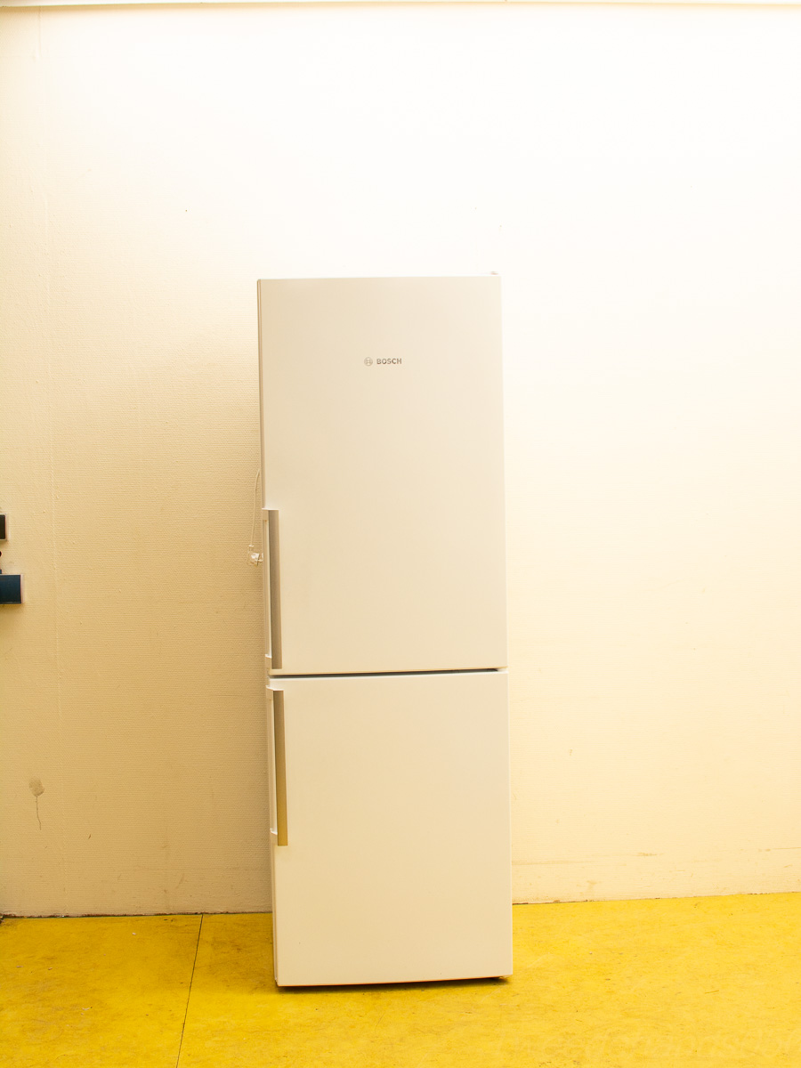 Modern white BOSCH refrigerator with two doors, blending style and functionality for any kitchen.