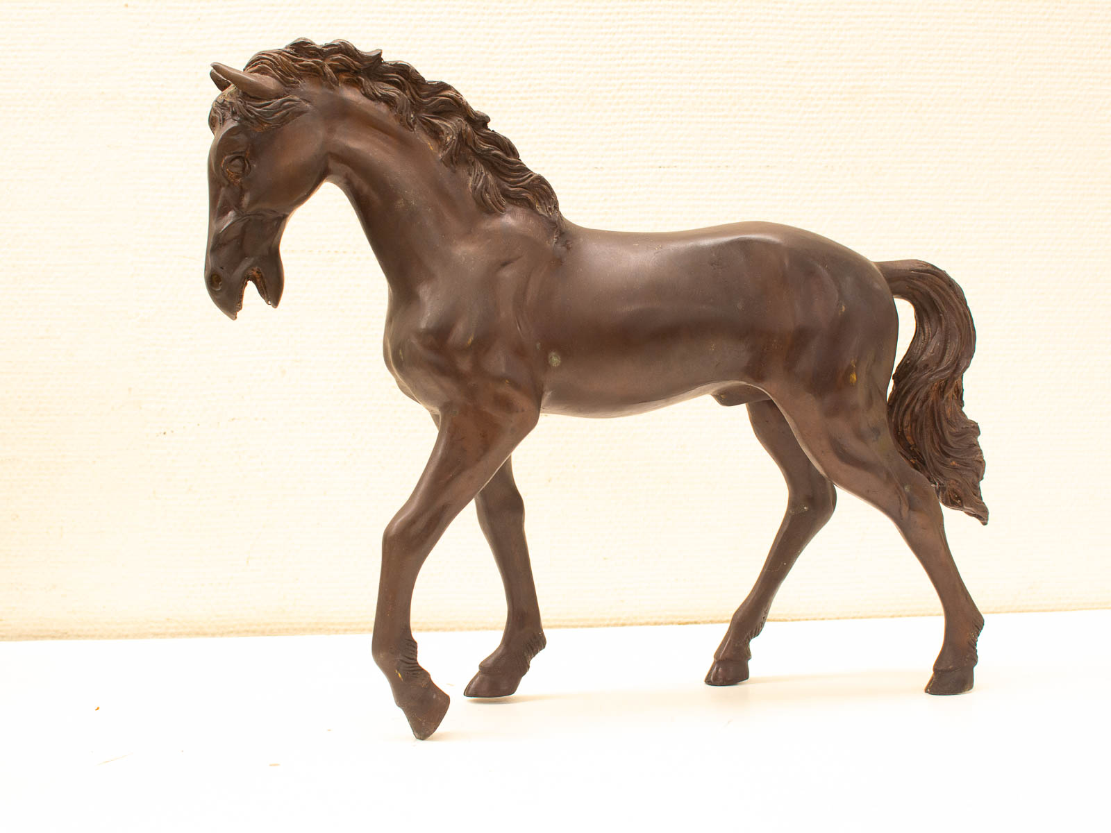 Elegant bronze horse sculpture capturing beauty and movement, perfect for any decor style.