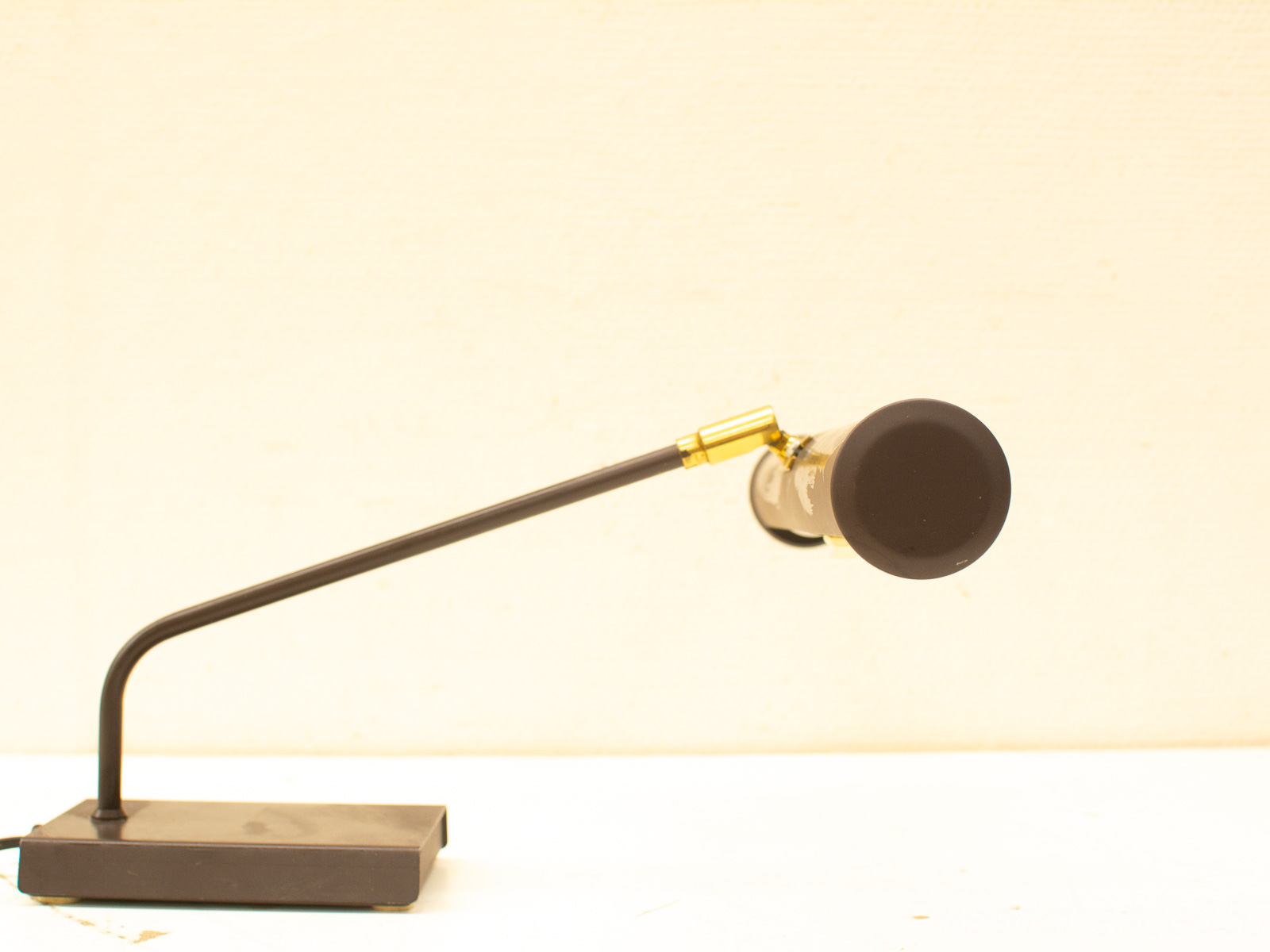 Sleek adjustable microphone on a stylish base, perfect for studio or performance use.