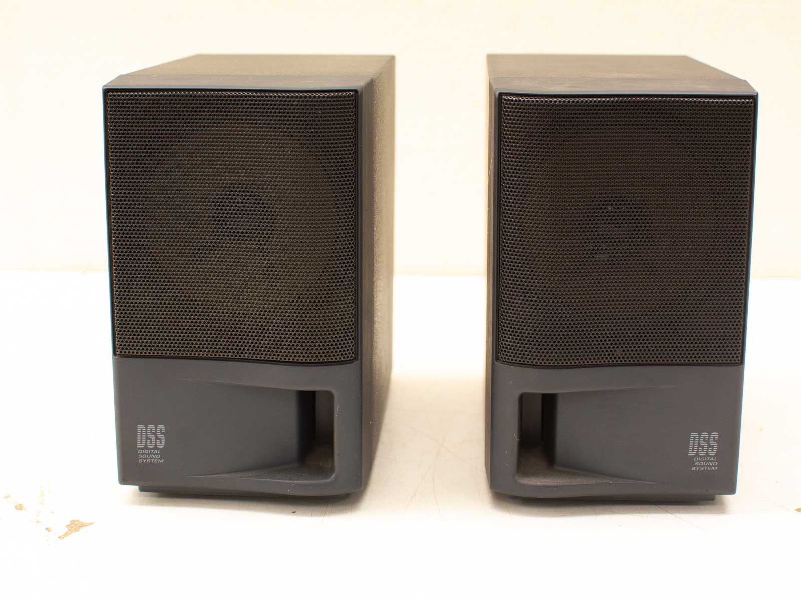 Sleek matte black DSS speakers for superior sound quality in any audio setup.