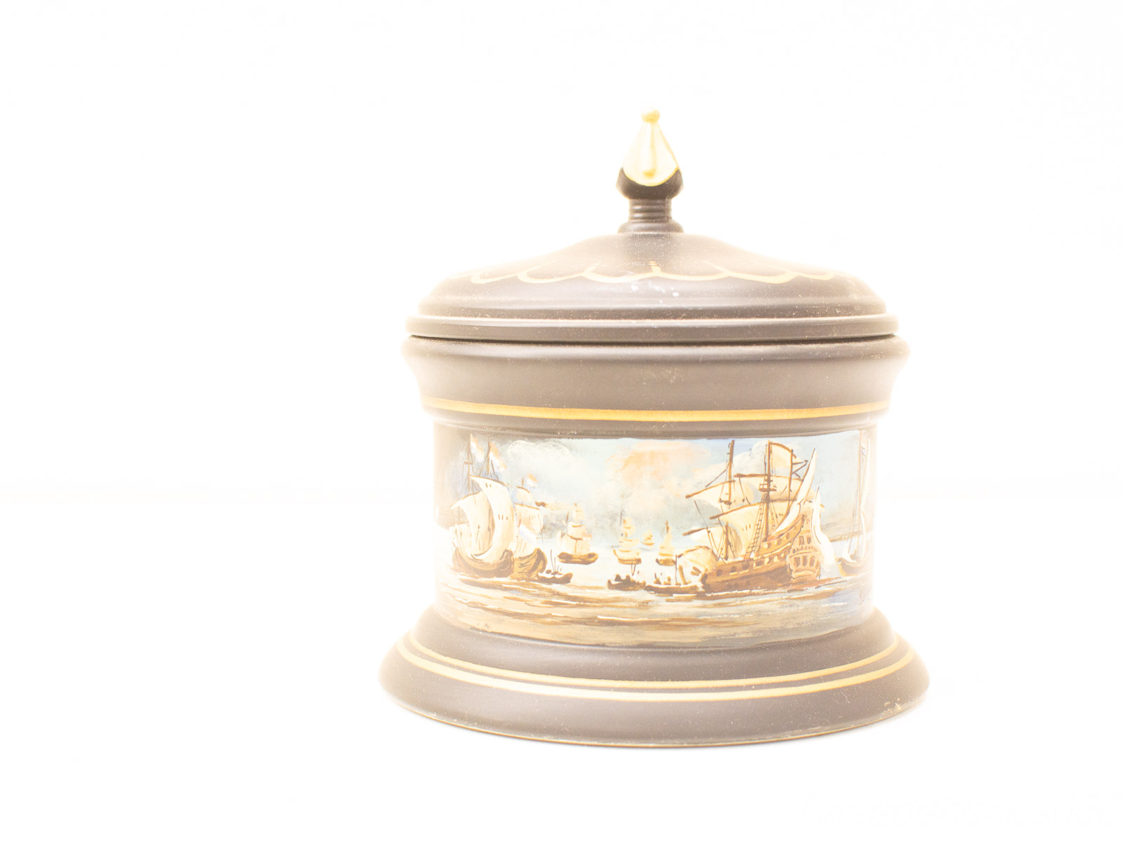 Elegant lidded container with maritime design, rich brown finish, and gold accents for home decor.