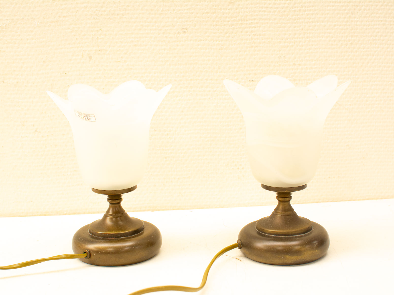 Elegant vintage lamps with flower-shaped glass shades in bronze, perfect for enhancing home decor.