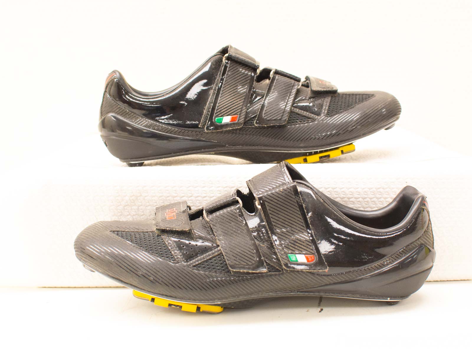 High-performance black cycling shoes with adjustable straps and rigid soles for optimal efficiency.