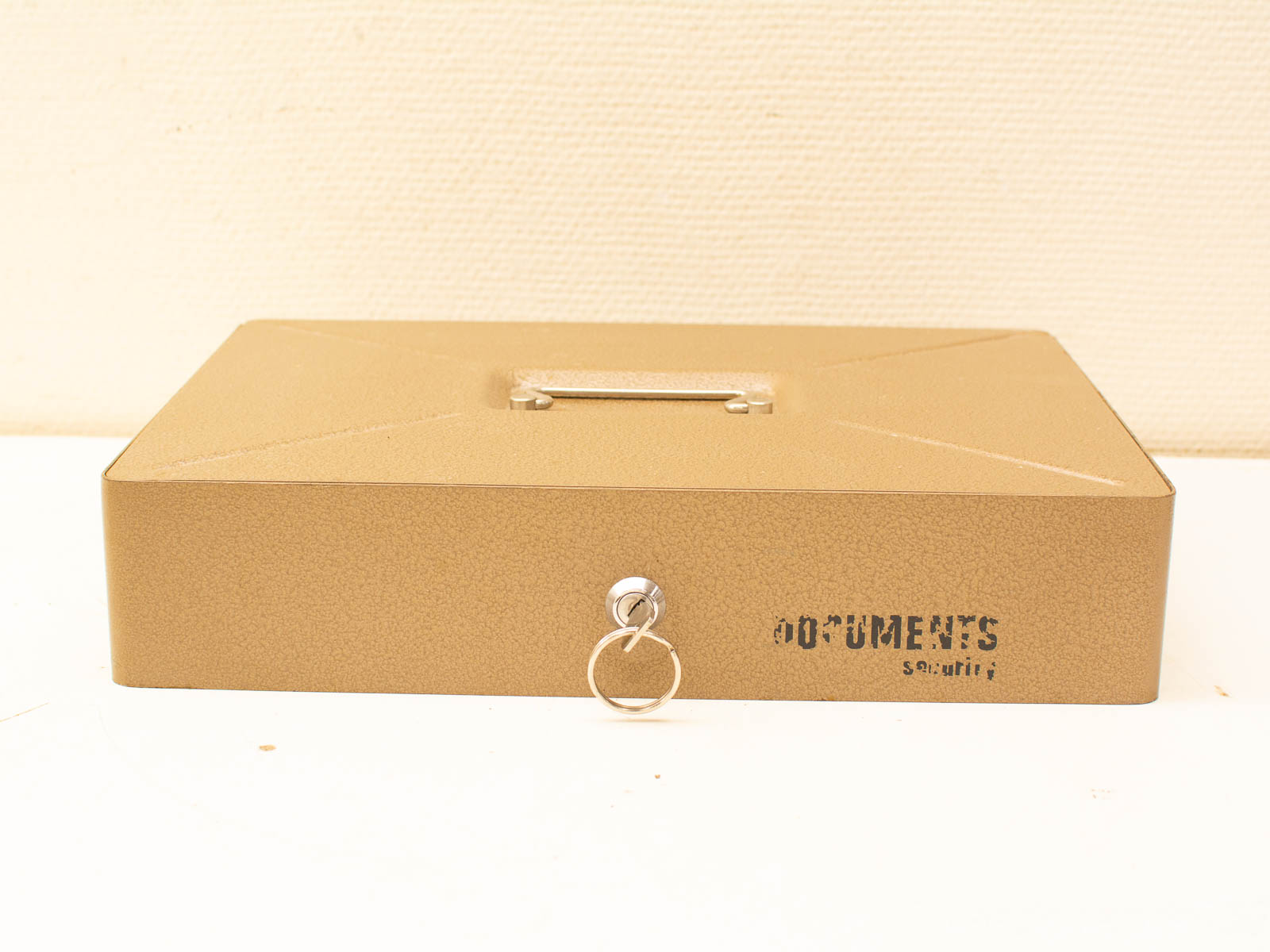 Stylish gold metallic document box with texture, secure locking, and modern design for organization.