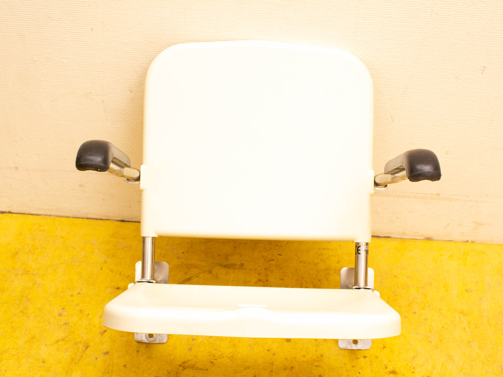 Stylish white chair with armrests, ergonomic design for comfort in classrooms or waiting areas.