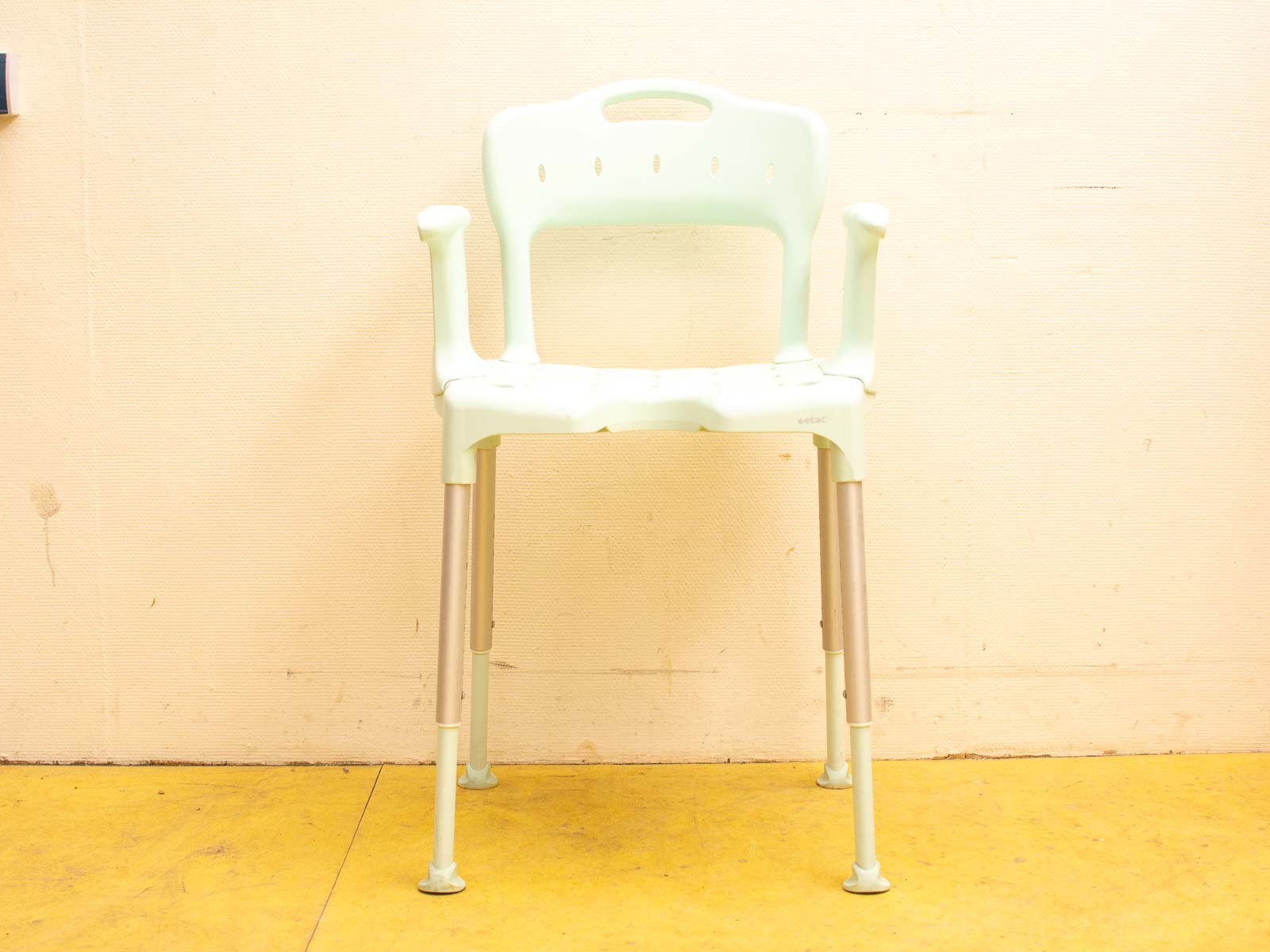 Modern mint green chair with metal legs, perfect for indoor and outdoor use.