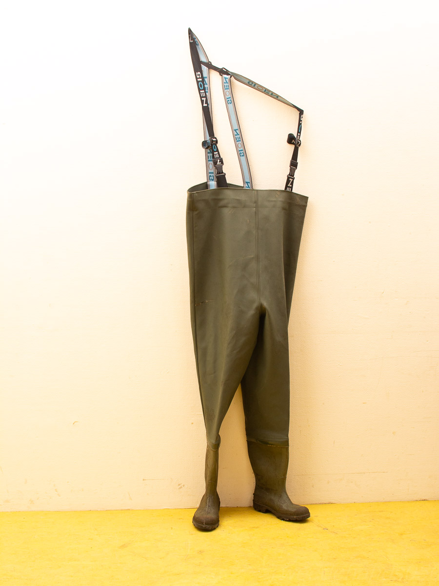 Vintage green waterproof waders with adjustable straps and integrated boots for outdoor adventures.