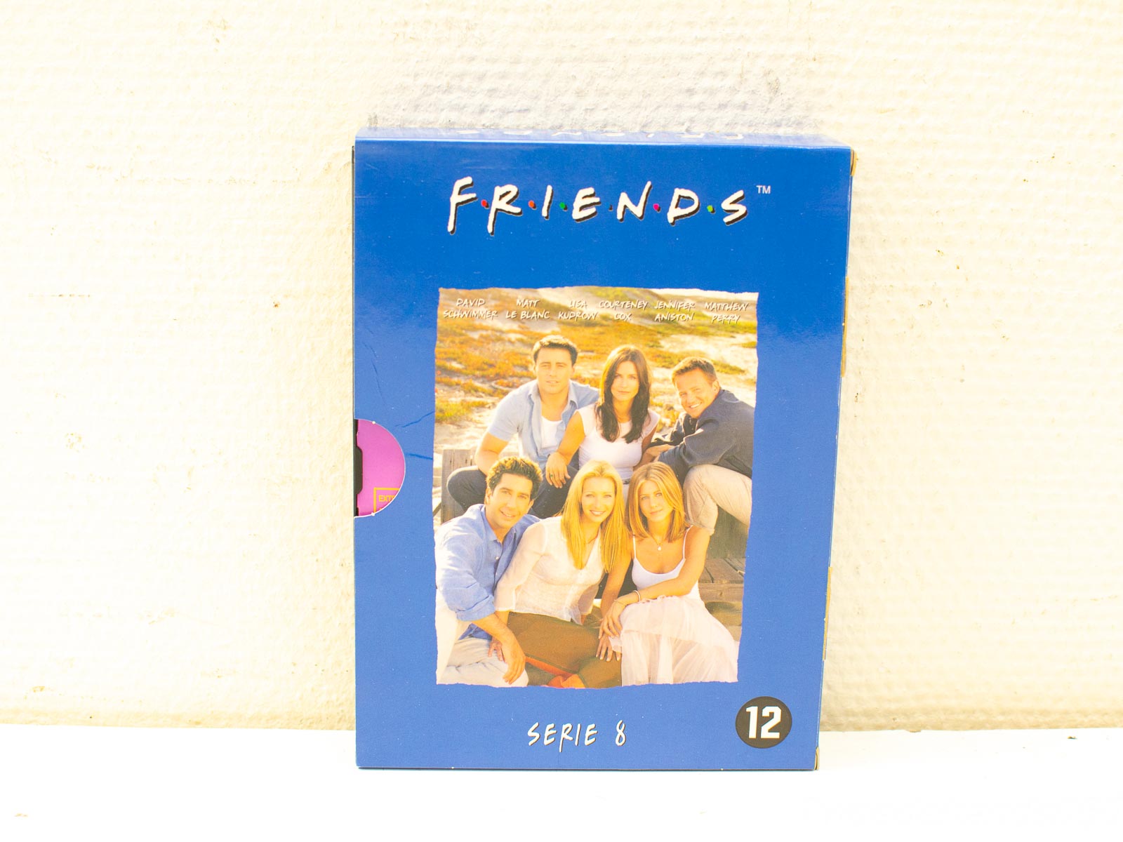 Nostalgic VHS box set of Friends Season 8, featuring iconic characters and vibrant design.