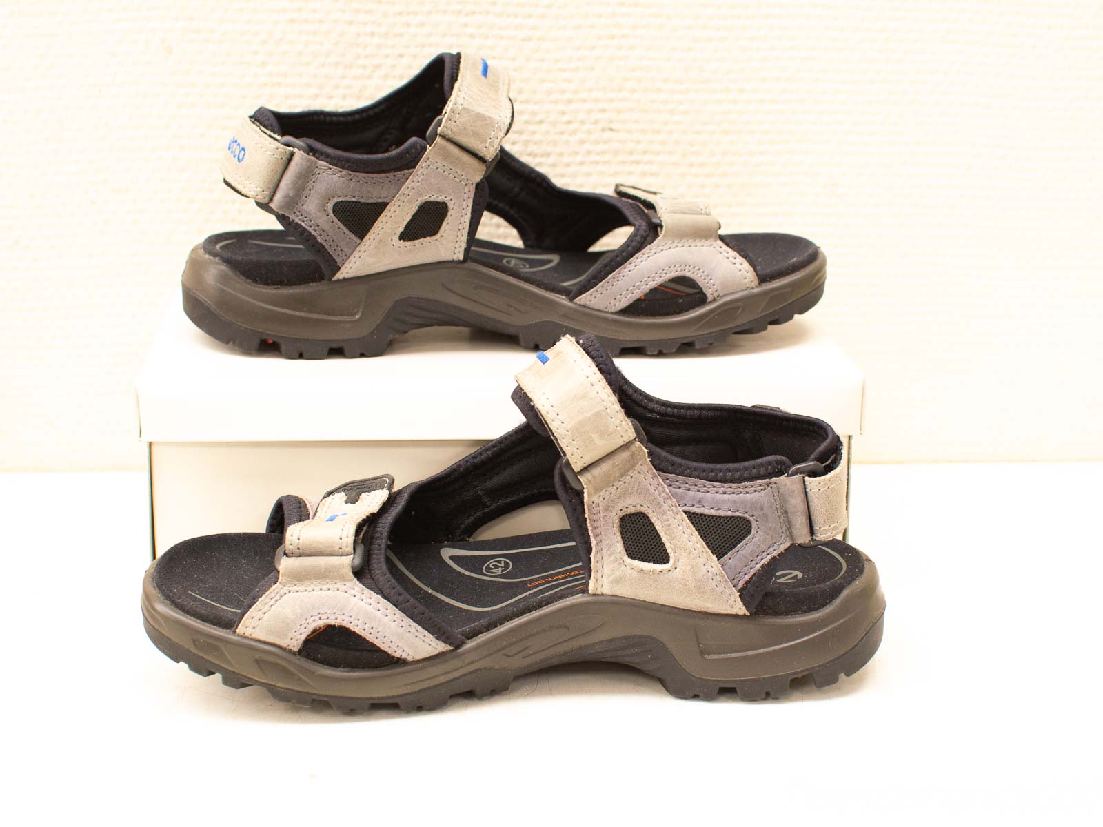 Stylish gray-black outdoor sandals with adjustable straps for adventures and casual wear.