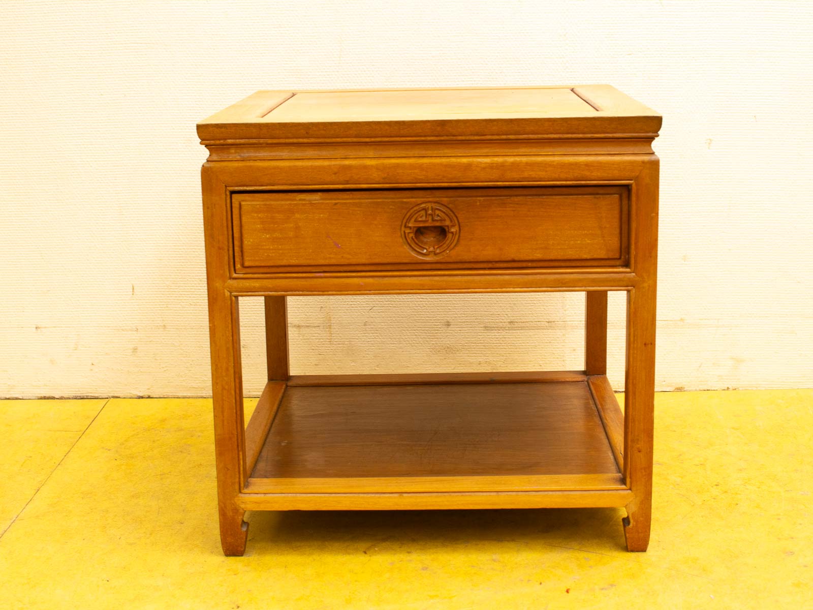 Elegant wooden side table with polished top, drawer, and lower shelf for stylish storage.