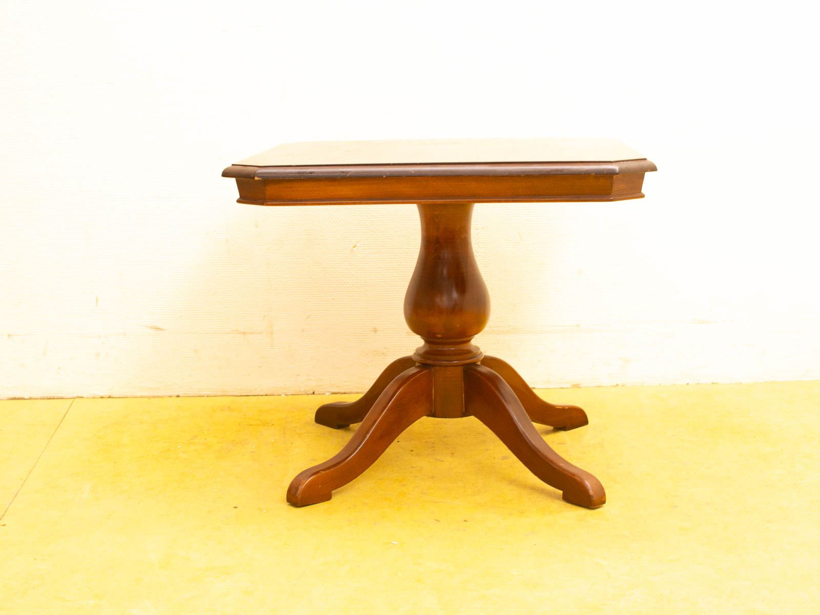 Elegant wooden table with rounded edges and polished finish, perfect for any interior style.