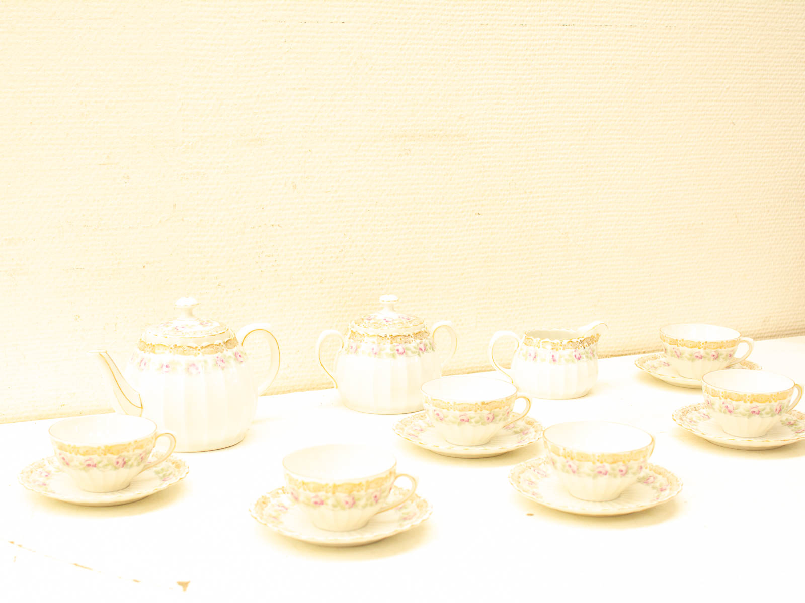 Elegant porcelain tea set with floral patterns and gold accents for special occasions.