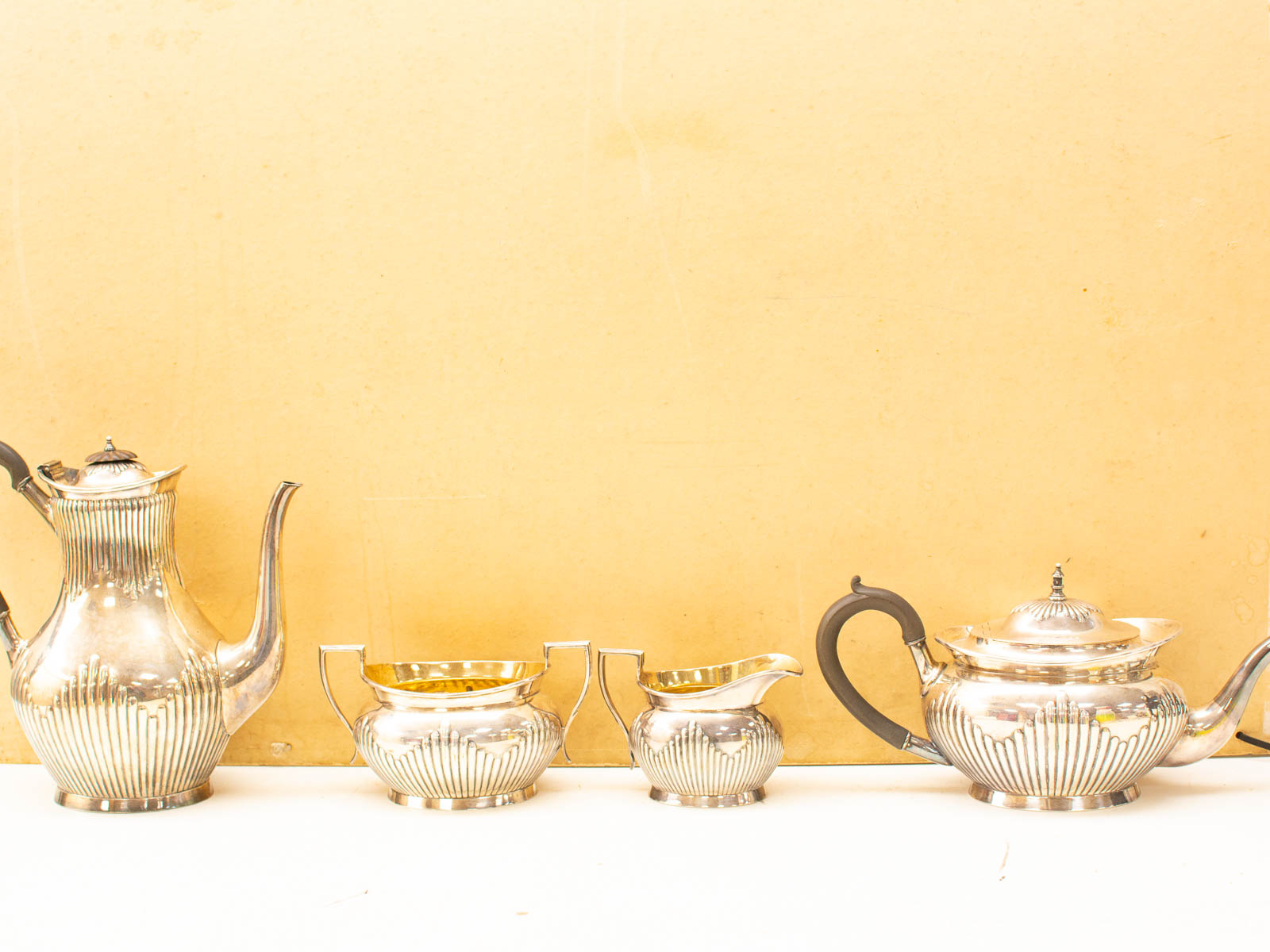 Elegant silver-plated tea set with intricate designs, perfect for formal tea occasions and collections.