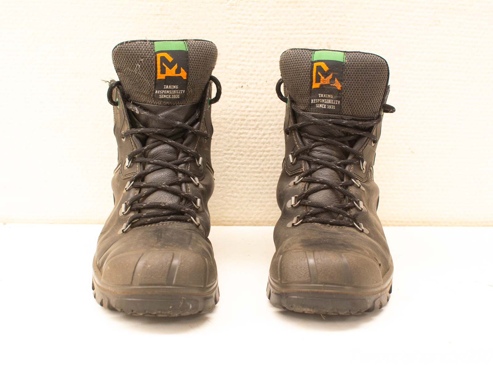 Durable black high boots for outdoor work, hiking, and challenging terrains. Quality and support guaranteed.