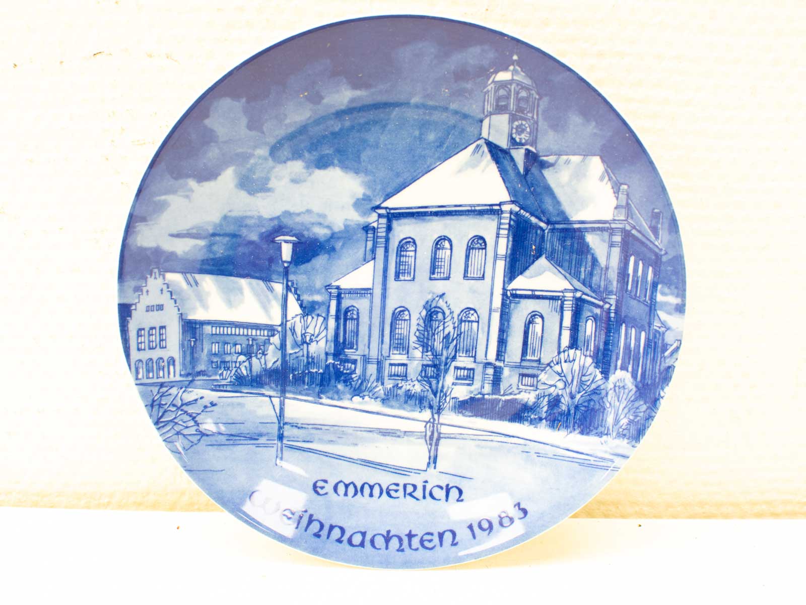 Vintage blue and white Emmerich Christmas plate 1983 featuring a charming church scene.