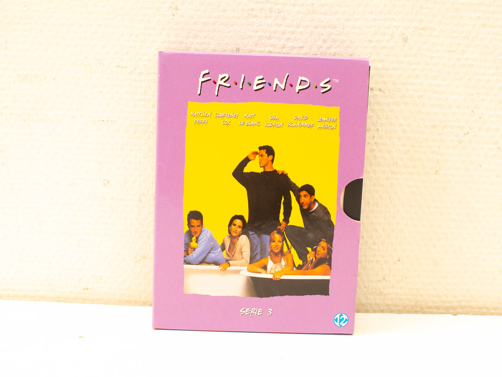 Friends Season 3 DVD cover: vibrant 90s nostalgia with the beloved cast and cheerful design.