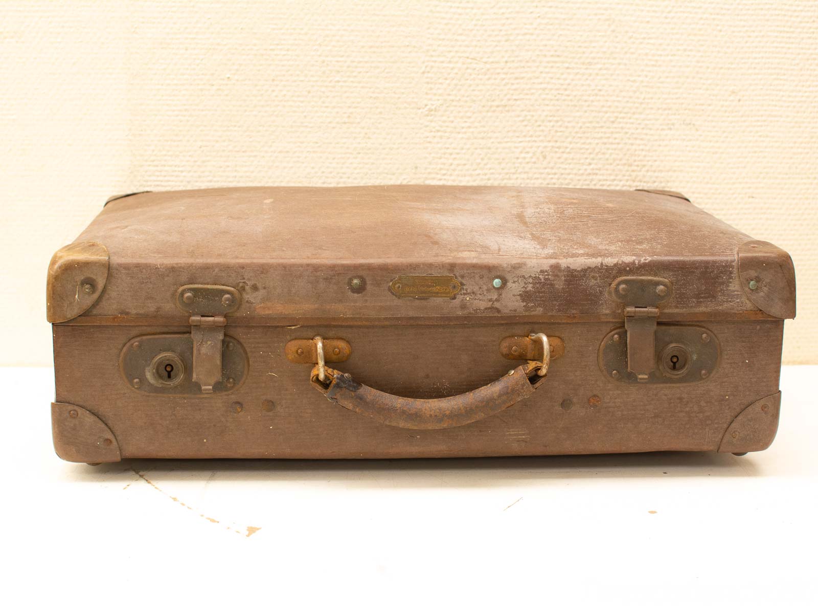 Timeless vintage suitcase with character, perfect for travel or home decor storytelling.