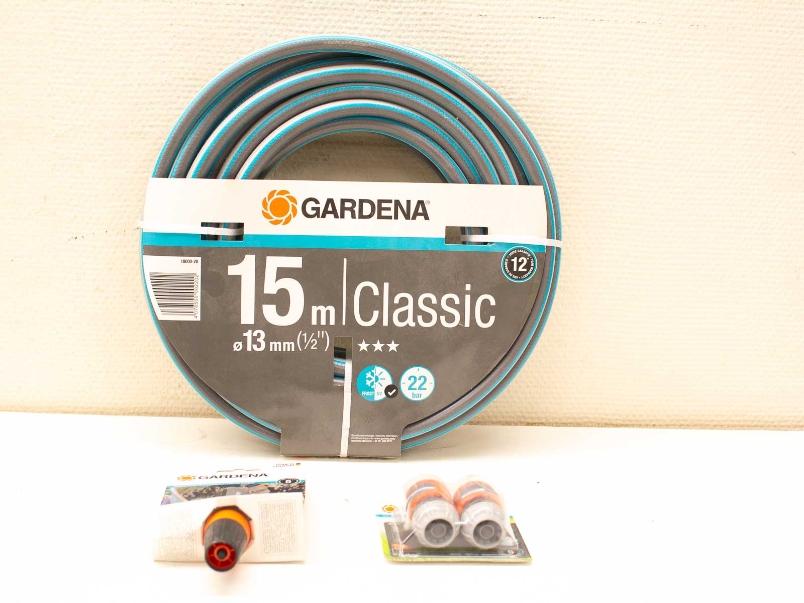 GARDENA 15m garden hose with nozzle and adapters, freeze-resistant, high-pressure for all gardening tasks.