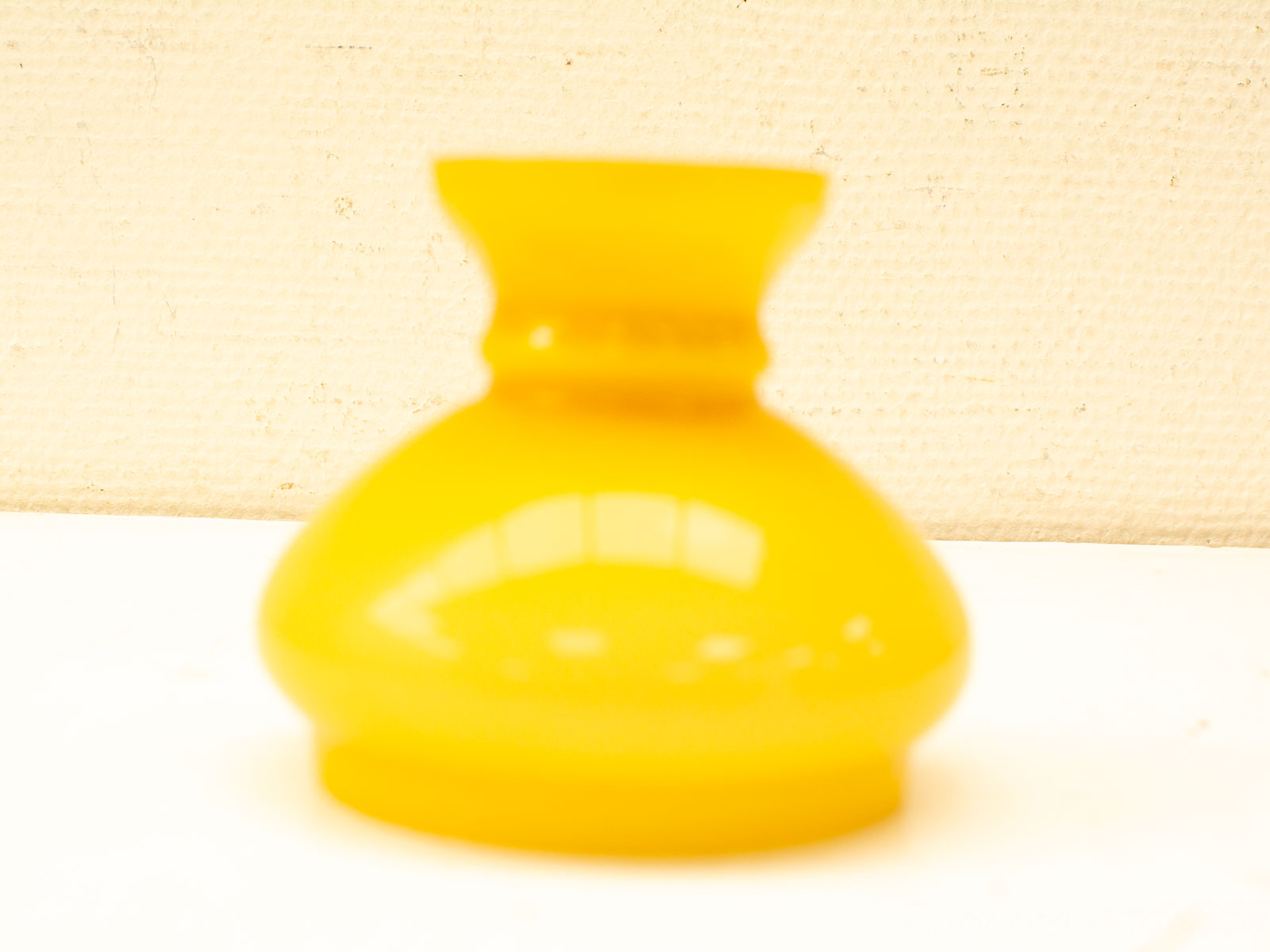 Bright yellow vintage vase, glossy finish, unique shape, perfect for adding cheer to any space.