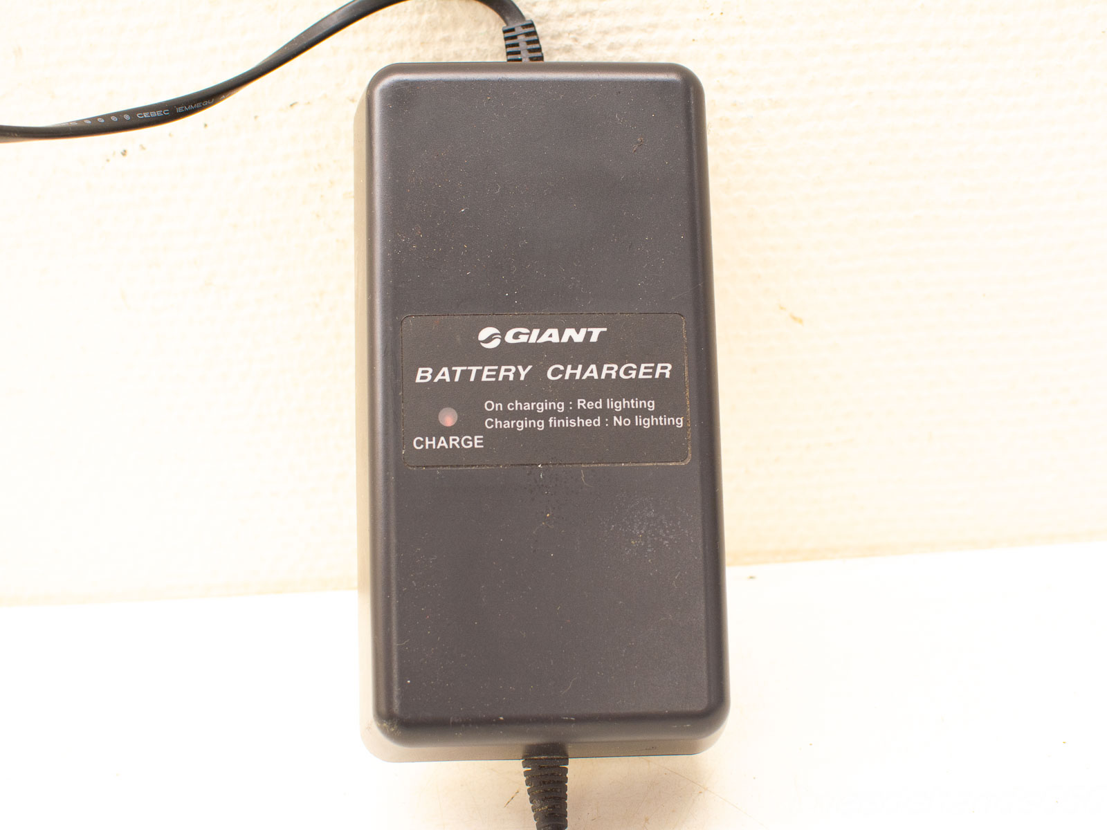 GIANT compact battery charger with clear indicators, ideal for home and workshop use.