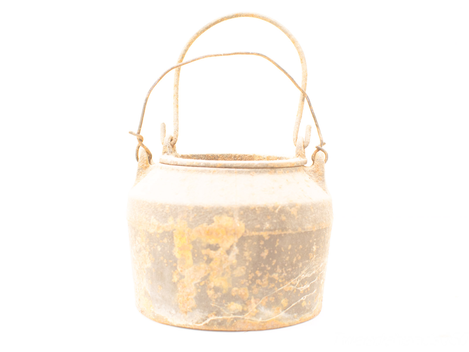 Rustic vintage metal pot with a worn handle, showcasing unique textures and rich history.