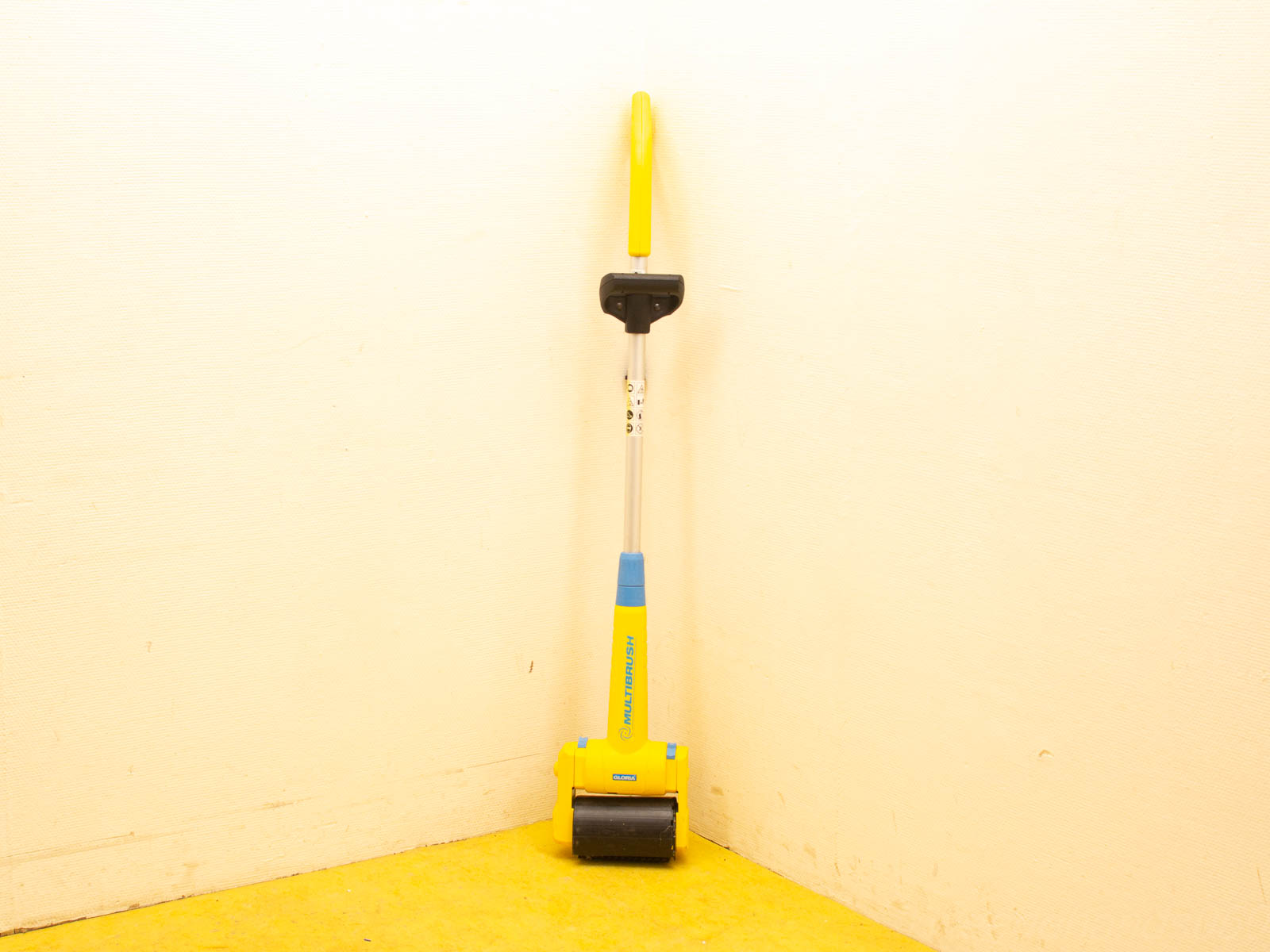 Modern yellow broom with ergonomic design for efficient cleaning in homes and workshops.