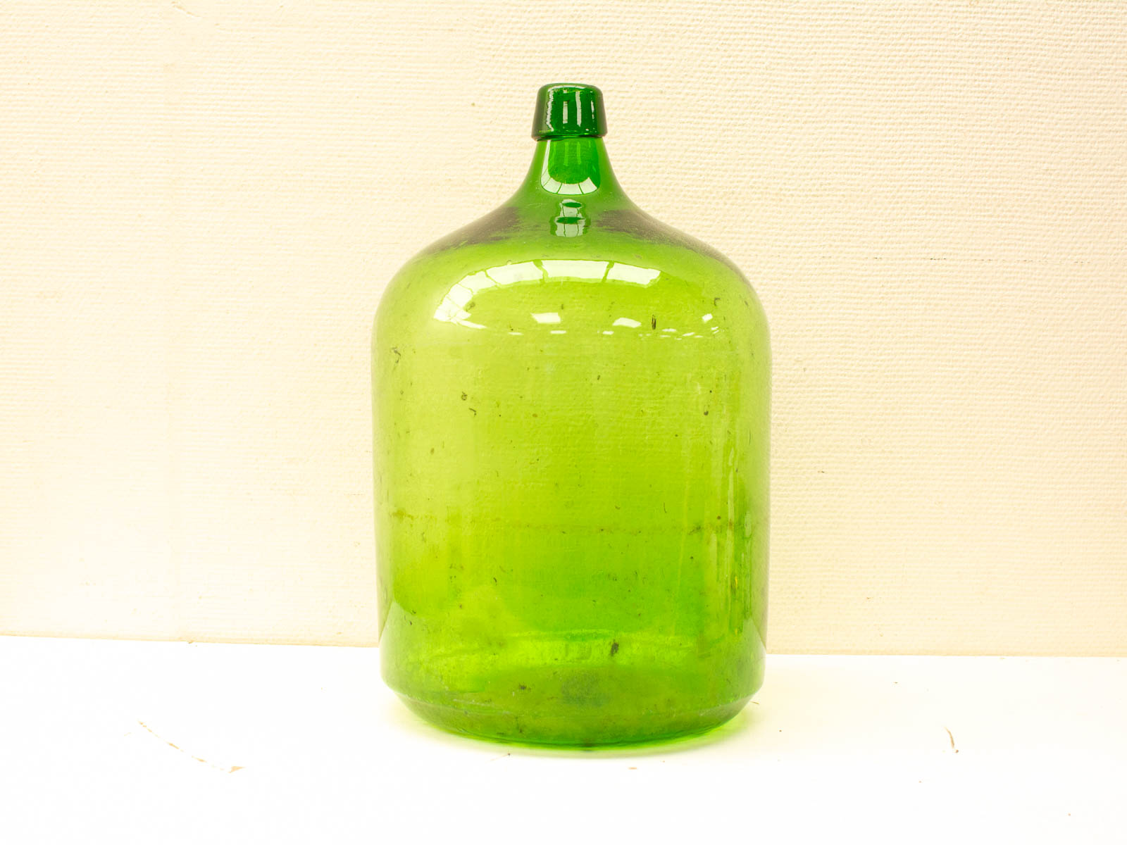 Handcrafted vintage green glass jug, perfect for decor and eco-friendly storage solutions.