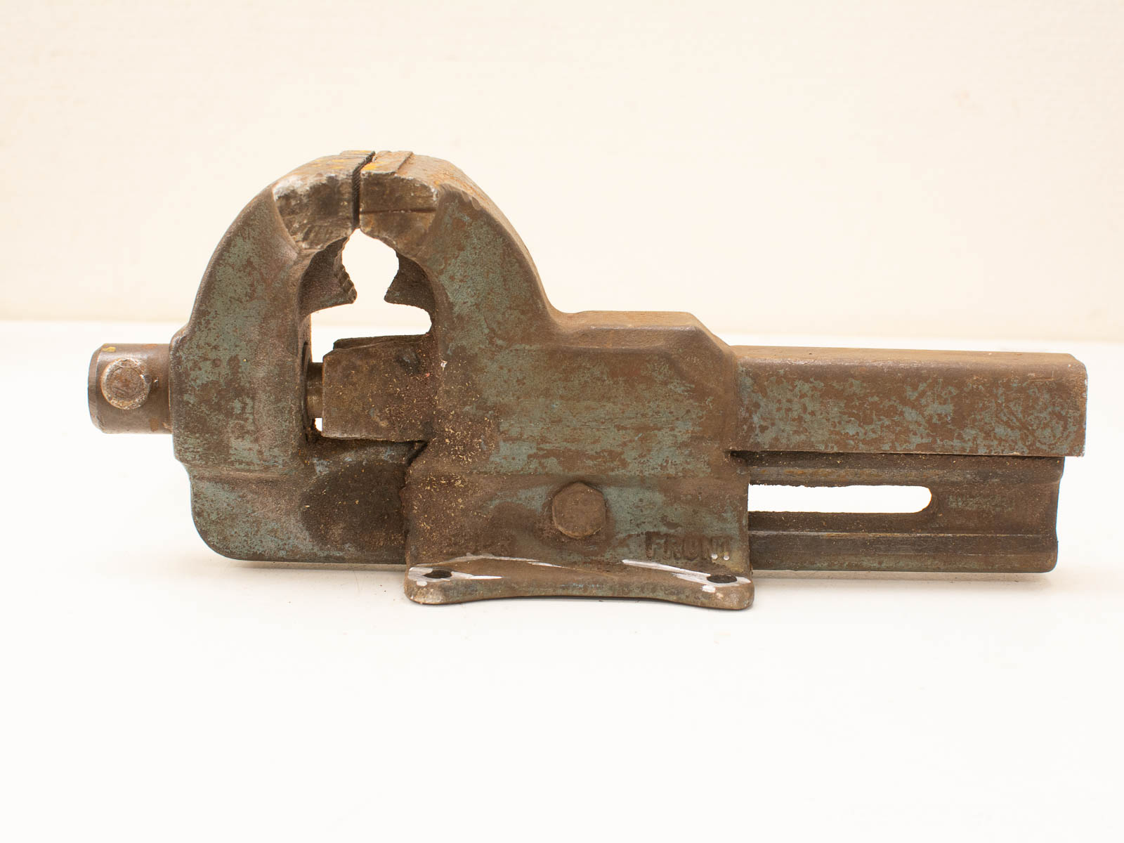 Vintage cast iron pipe vise, durable plumbing tool with weathered patina and secure clamping mechanism.