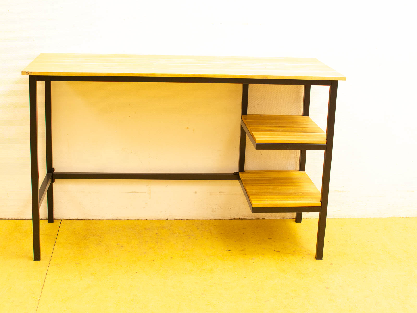 Sleek modern wooden desk with black metal frame and angled shelves, perfect for stylish workspaces.