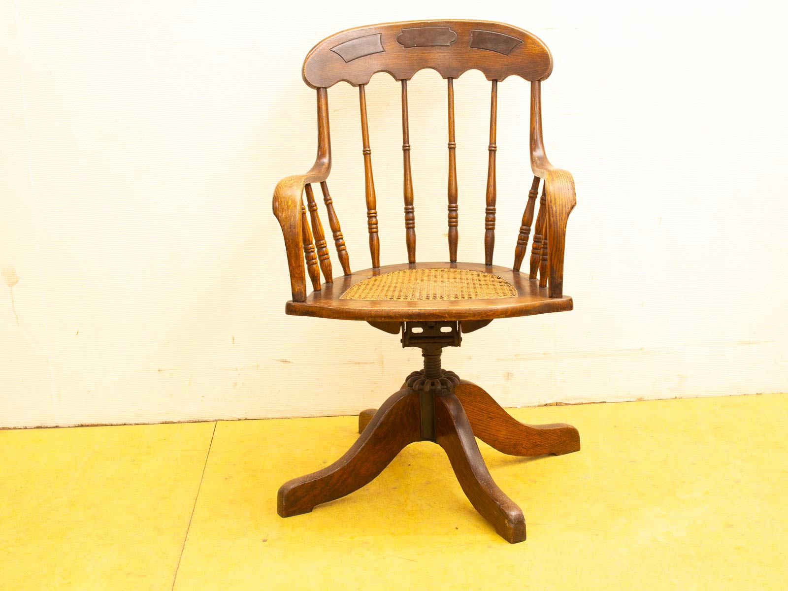 Elegant vintage wooden chair with rattan seat, perfect for style and comfort in any space.