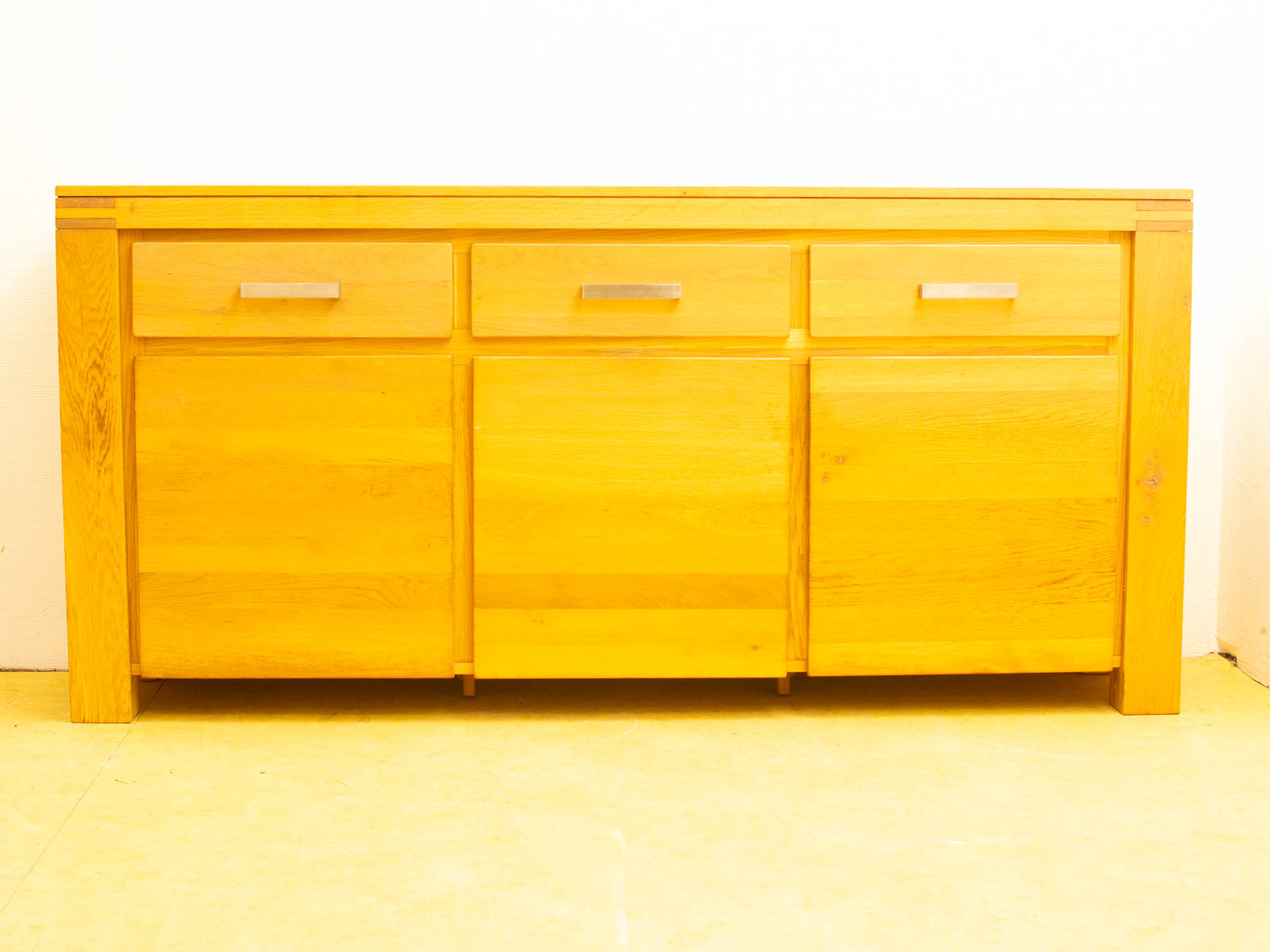 Elegant wooden sideboard with minimalist design, perfect for stylish and functional storage solutions.