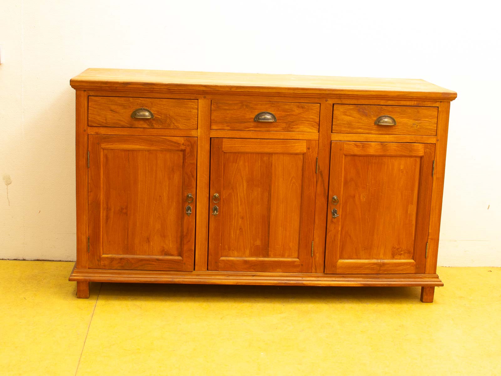 Vintage wooden cabinet with drawers and doors for stylish and functional storage solutions.