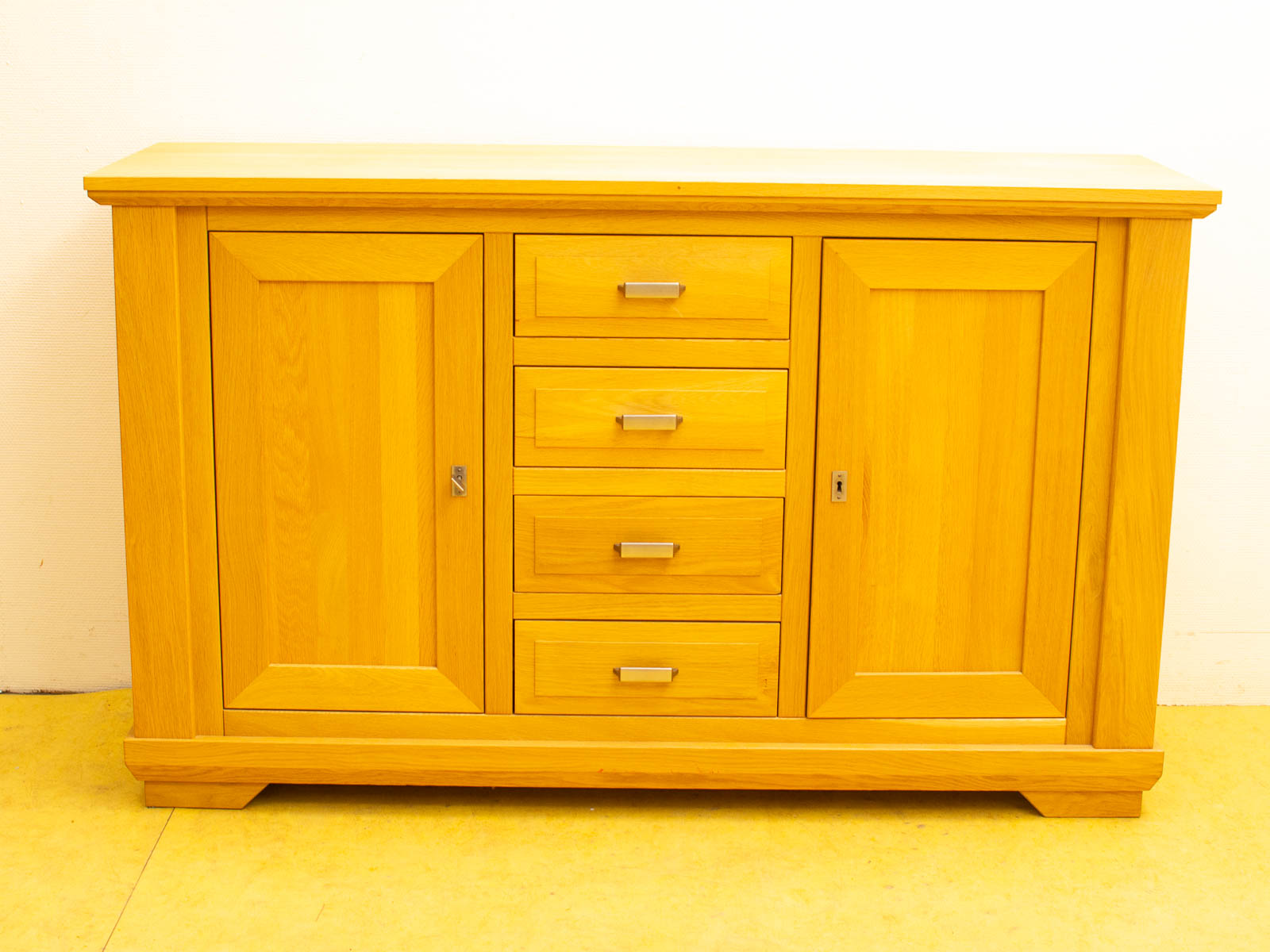 Modern wooden cabinet with drawers and door for stylish vintage storage solutions.