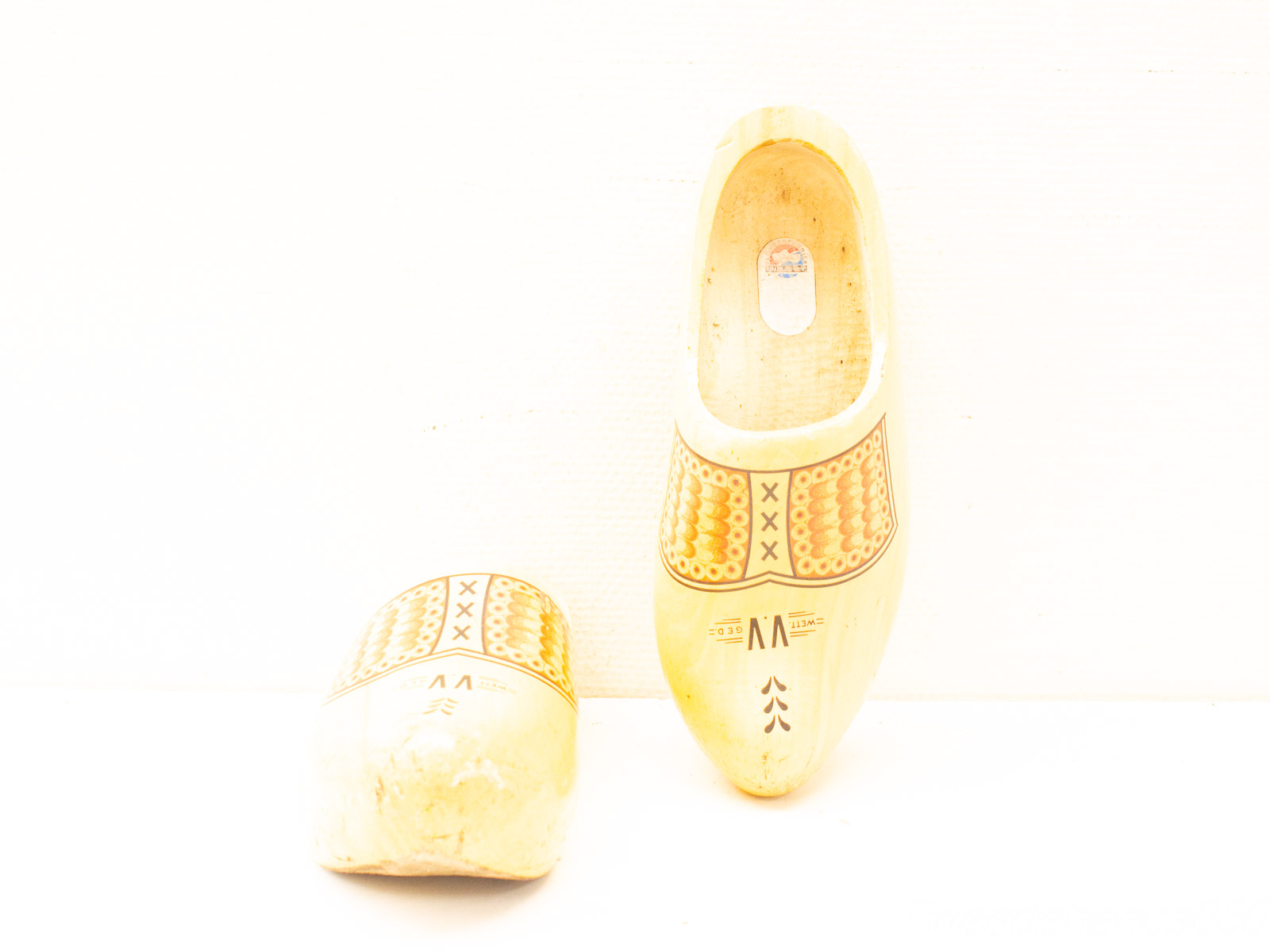 Traditional Dutch wooden clogs with colorful patterns, showcasing craftsmanship and cultural heritage.