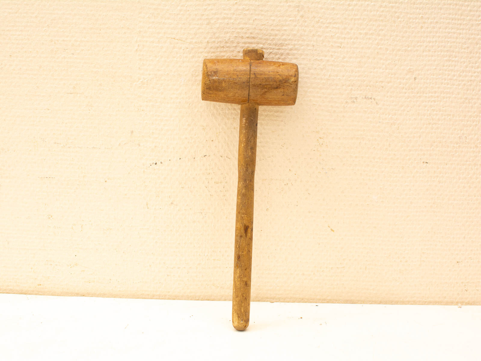 Handcrafted vintage wooden mallet, ideal for woodworking and showcasing traditional craftsmanship.