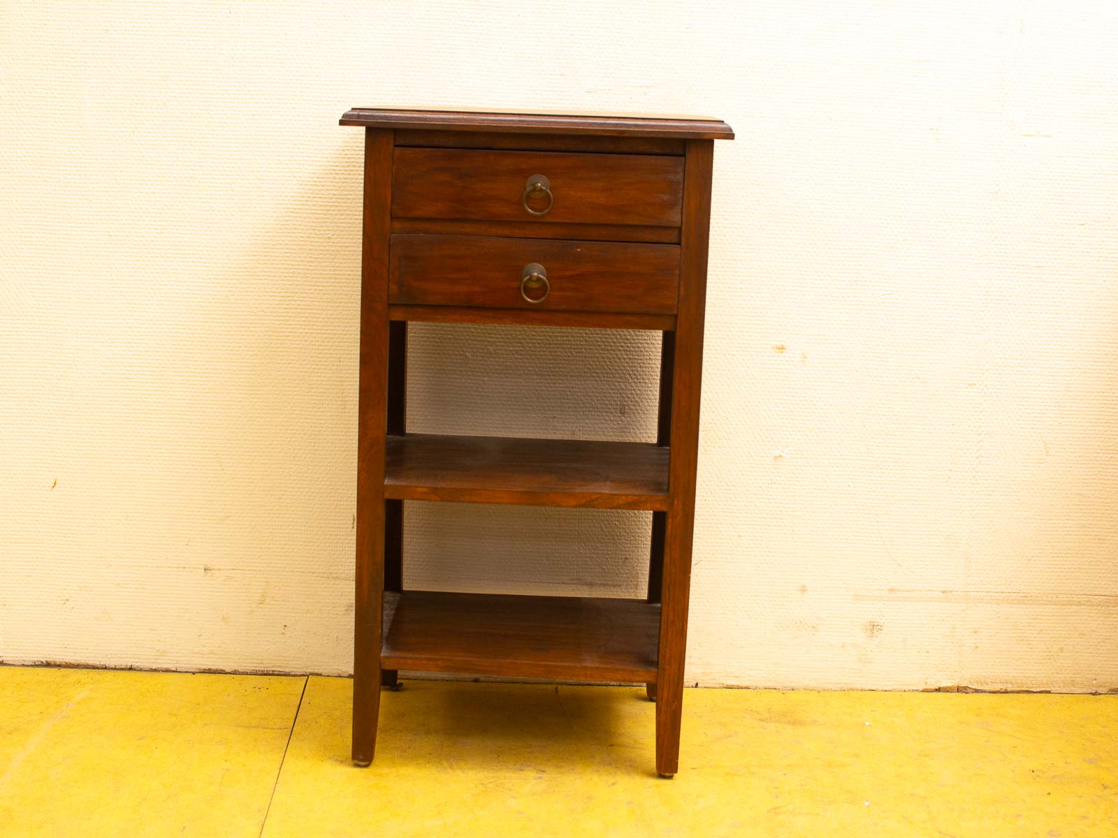 Elegant wooden side table with drawers and open shelves, perfect for stylish storage and display.