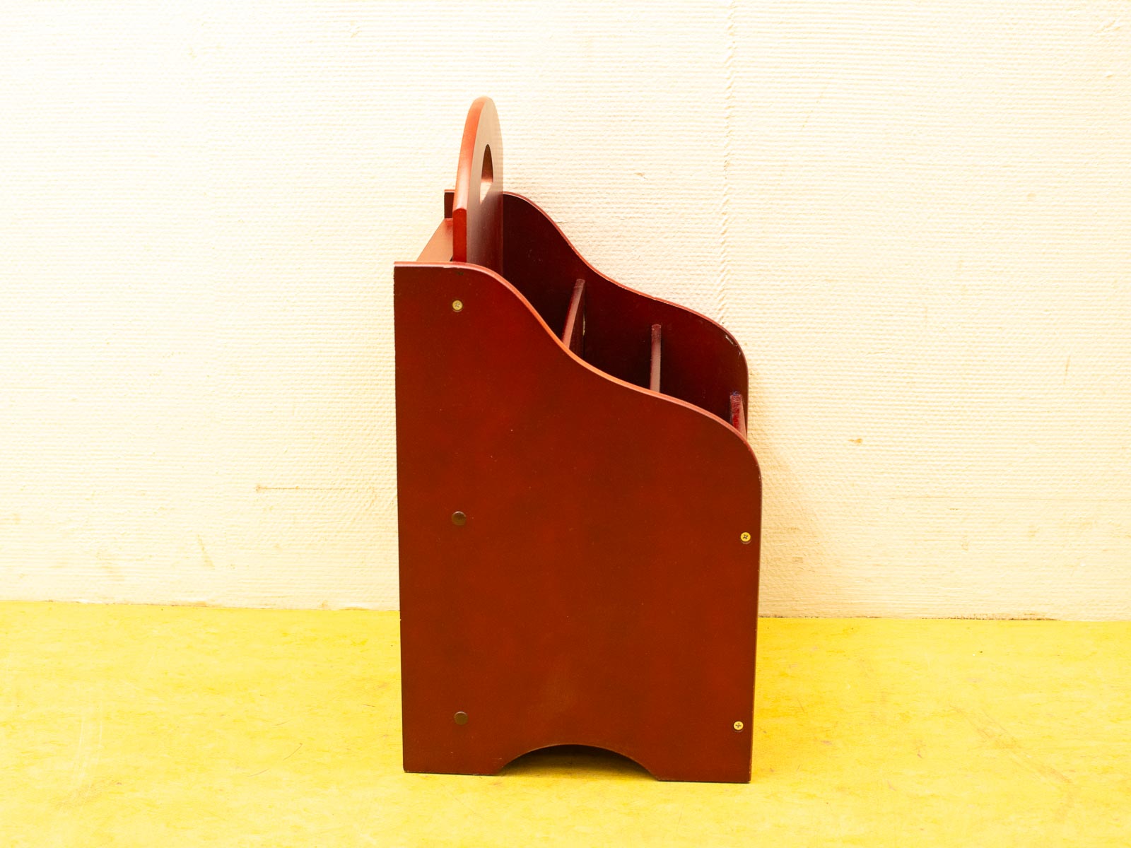 Deep red wooden storage caddy with handle and compartments for stylish organization in any space.