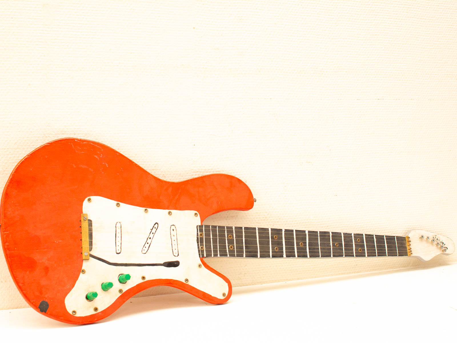 Vibrant orange electric guitar blending classic and modern styles, perfect for any musician.