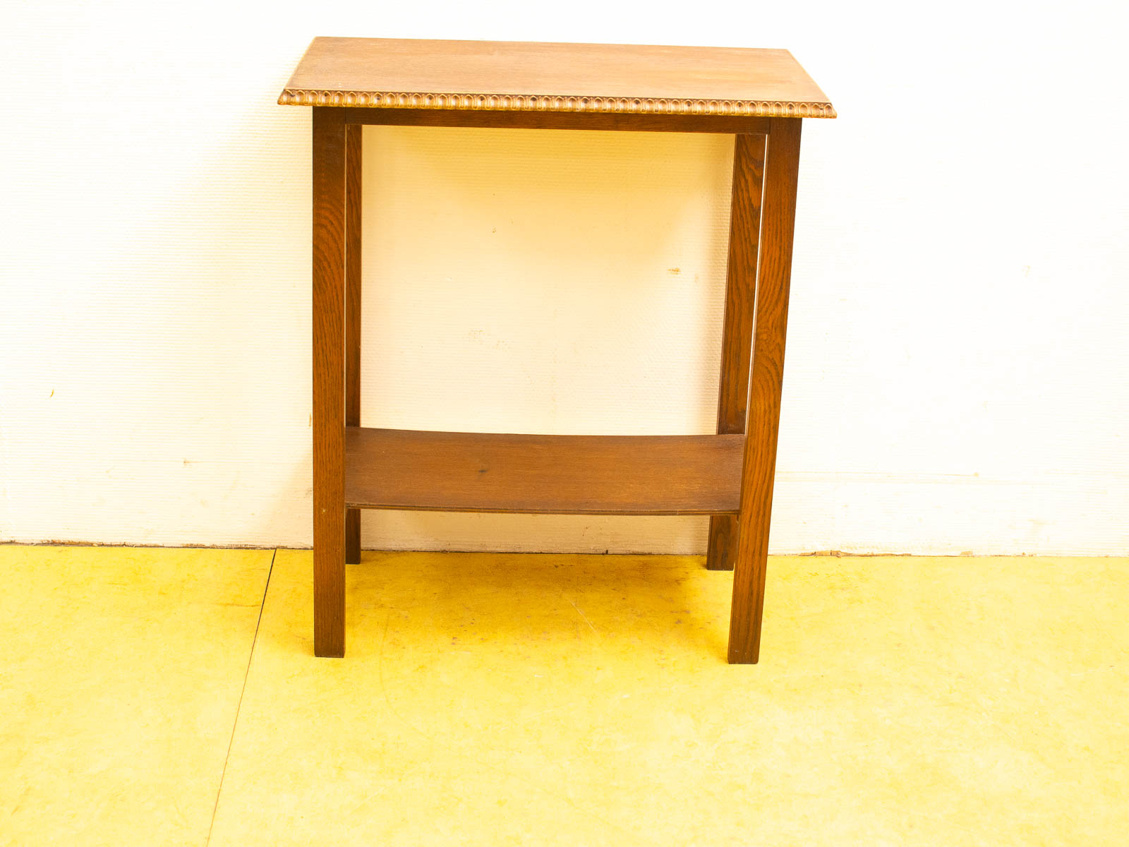 Elegant wooden side table with lower shelf and warm brown finish, perfect for any decor.