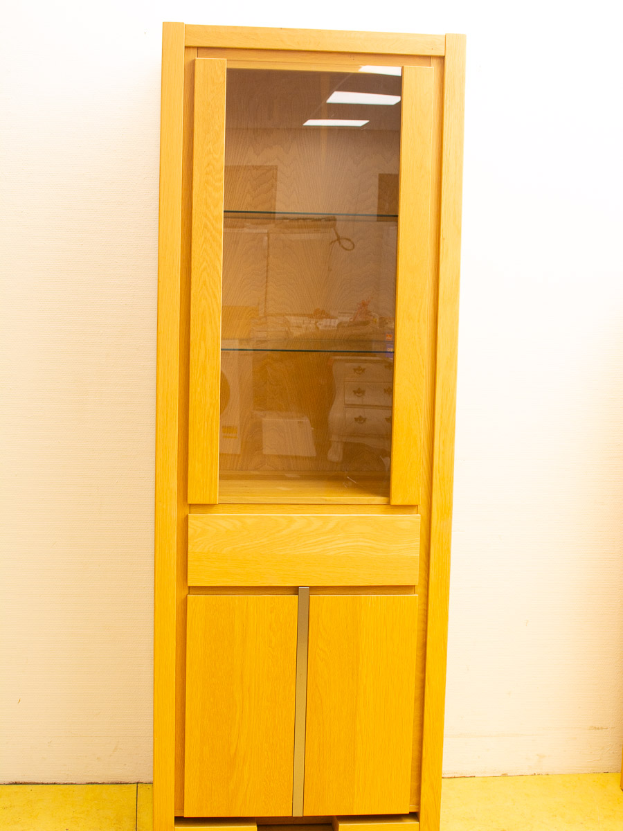 Contemporary wooden cabinet with glass doors, adjustable shelves, and practical storage for any decor.