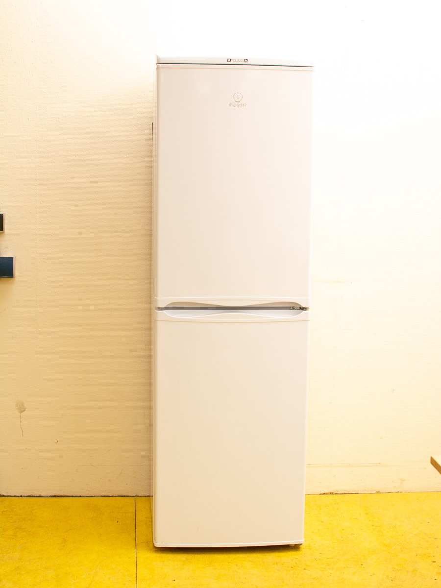 Sleek white refrigerator on vibrant yellow floor, perfect for modern minimalist kitchens.