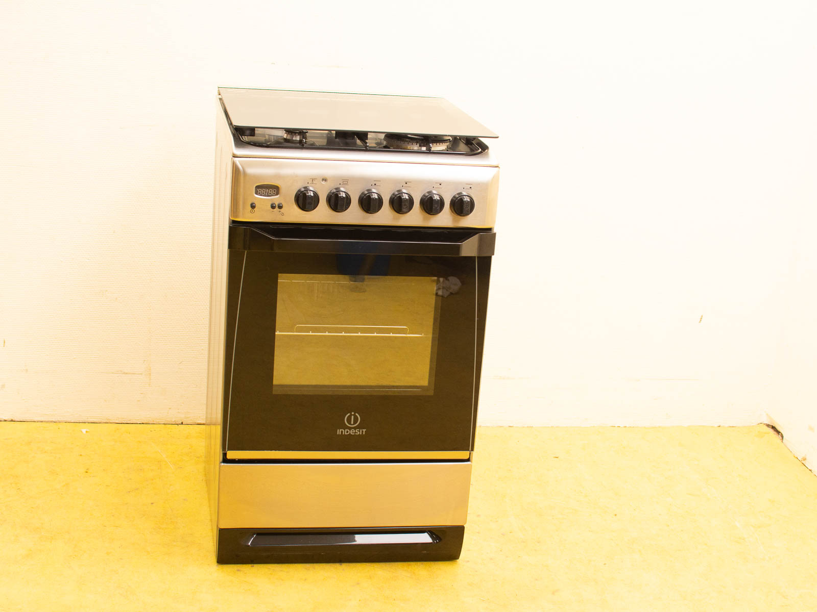 Sleek silver and black gas stove and oven combo, perfect for modern kitchens and efficient cooking.