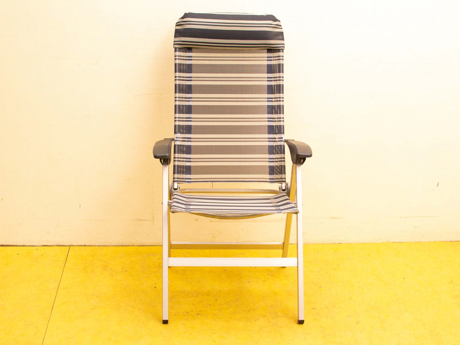 Stylish gray, blue, and beige folding chair for indoor and outdoor comfort and convenience.