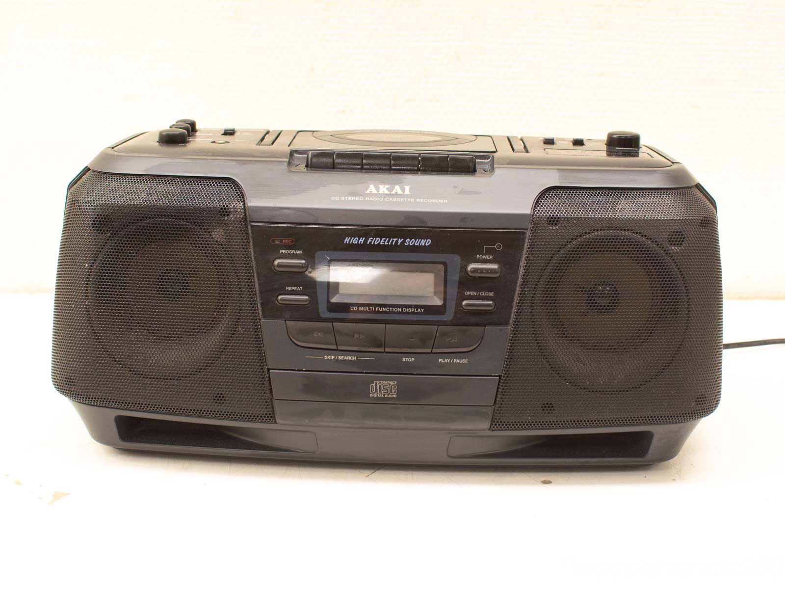 Vintage Akai boombox: portable CD, cassette, and radio player for music lovers and collectors.