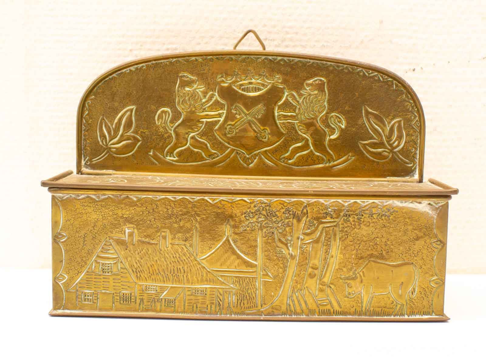 Elegant decorative box with lions and rural scenes, perfect for storage or display.